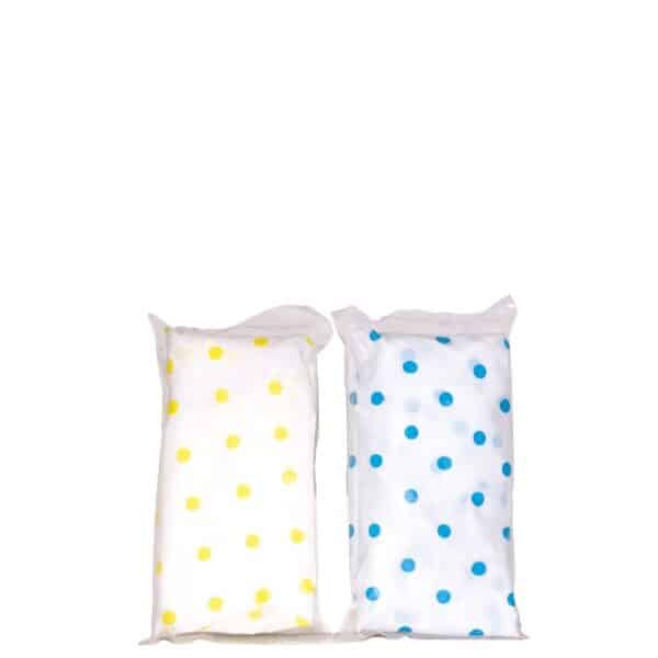 Two decorative white pillows with yellow and blue polka dots side by side.