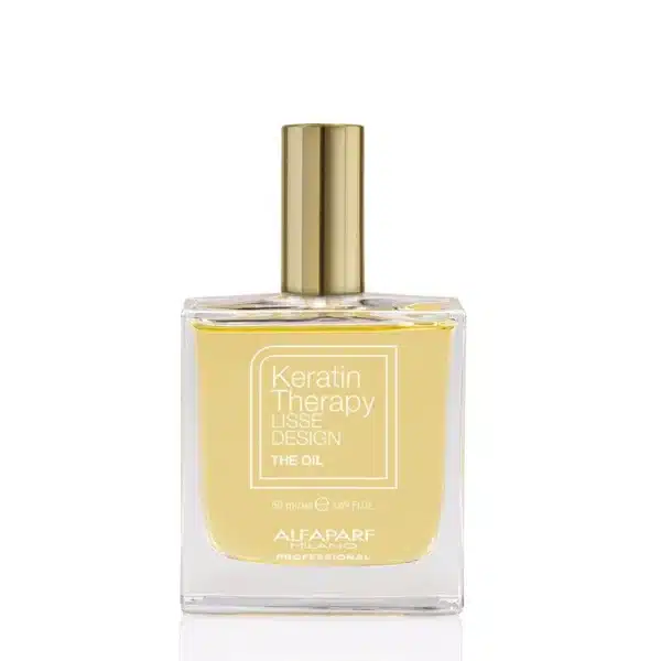 Perfume bottle labeled Keratin Therapy Lisse Design The Oil by Alfaparf Milano, clear glass with gold cap, pale yellow oil inside