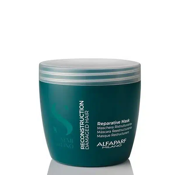 Teal jar labeled Reconstruct... Damaged Hair reparative mask by Alfaparf Milano with a silver lid (hair treatment product)