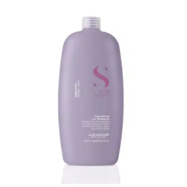 Purple bottle of shampoo with a pink logo, standing upright on a white reflective surface.