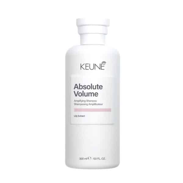 White Keune Absolute Volume amplifying shampoo bottle with pump dispenser and pink accent on label.